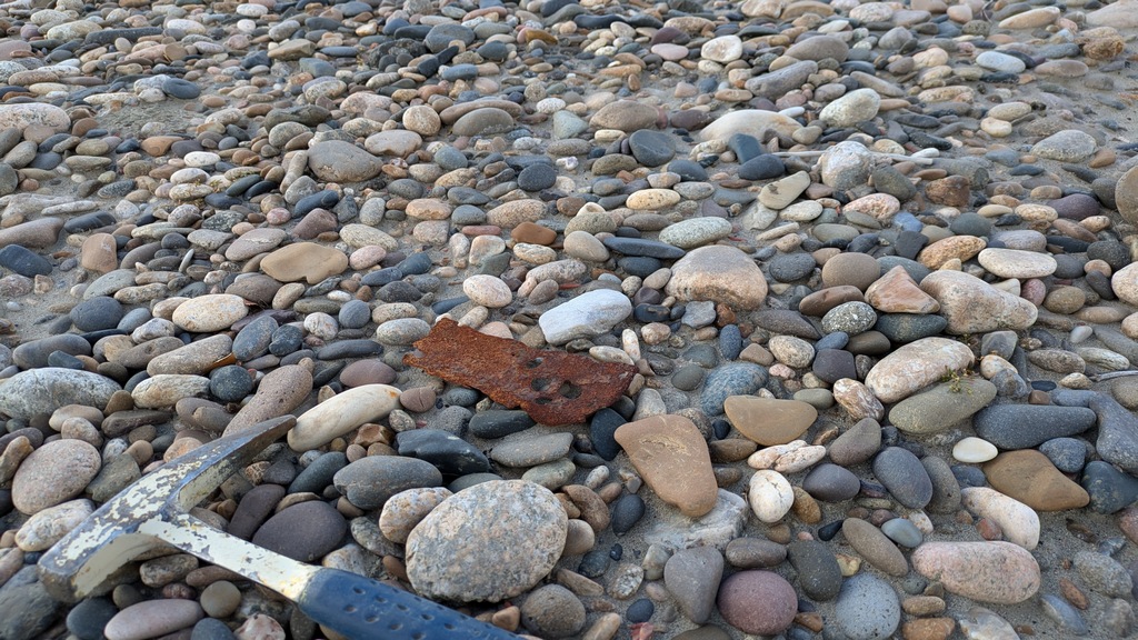 E2_RustyMetalOnPebbles.jpg
