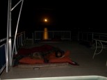 Moonrise over houseboat roof