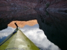Kayak and cloud reflections