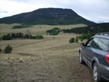 Car on road facing Black Mountain